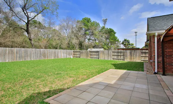 a backyard of a house with lots of green space
