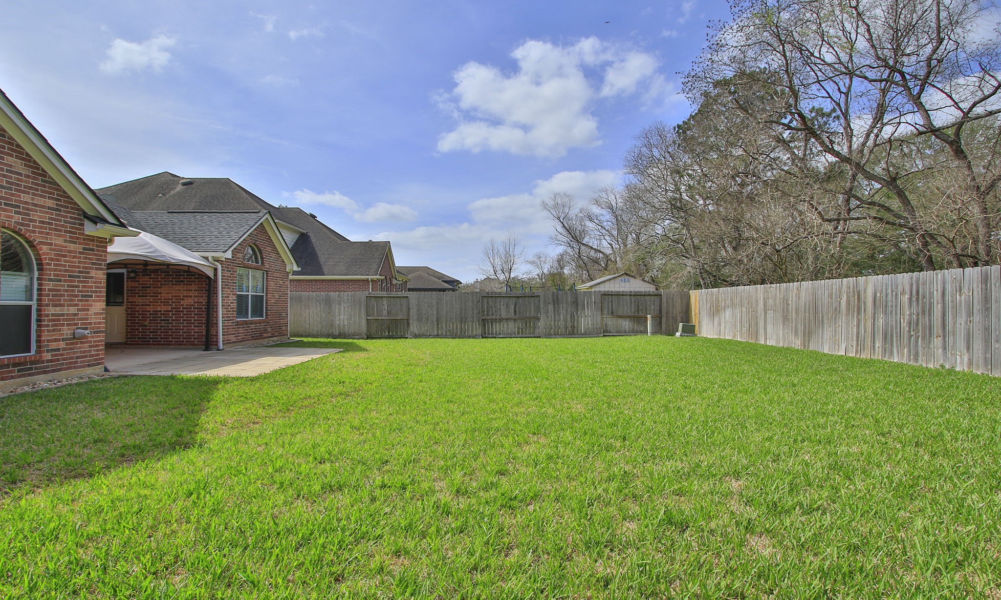 2802 Parkeston Drive Spring, TX 77388 - Photo 48 of 49 a view of a house with backyard and a tree