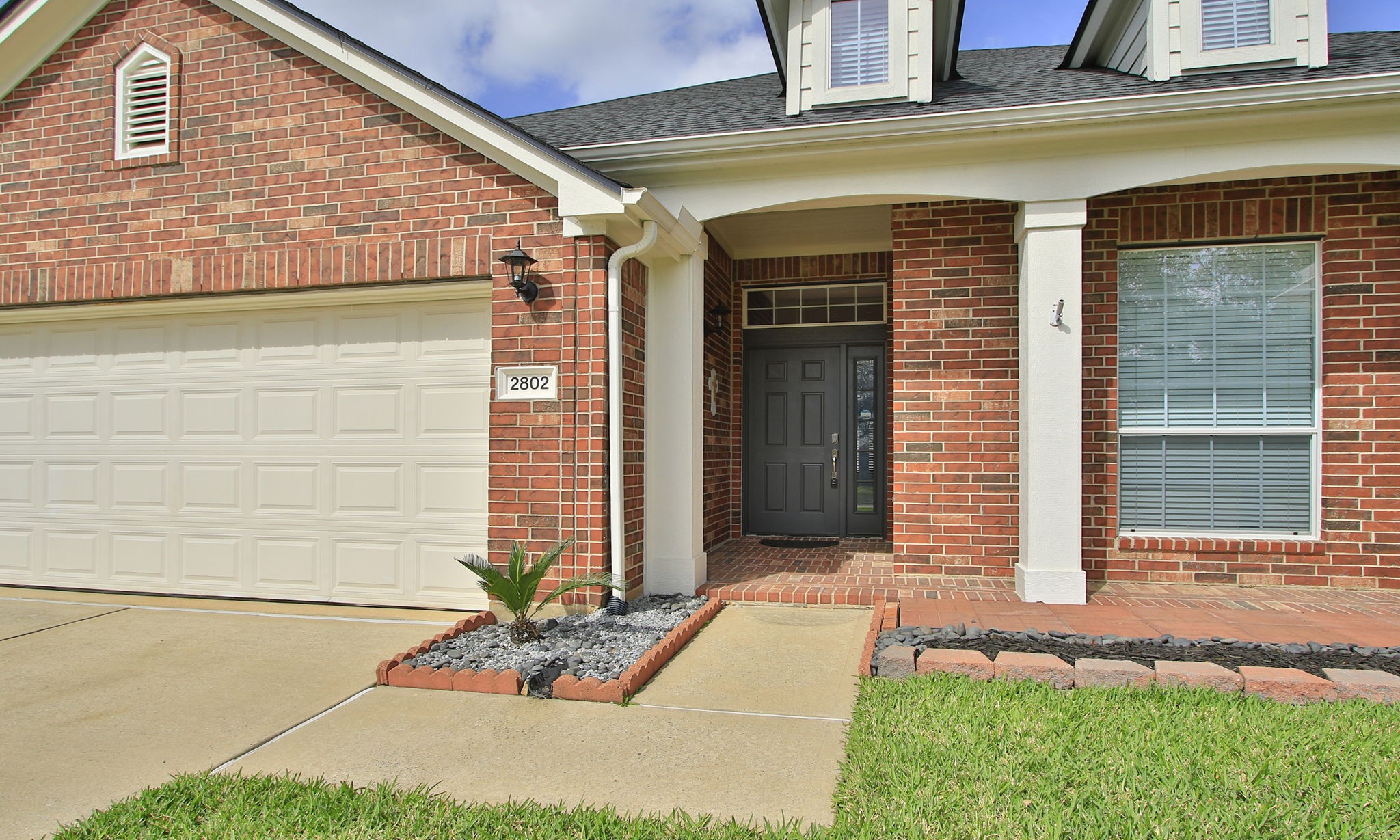 2802 Parkeston Drive Spring, TX 77388 - Photo 5 of 49 a front view of a house with a yard and garage
