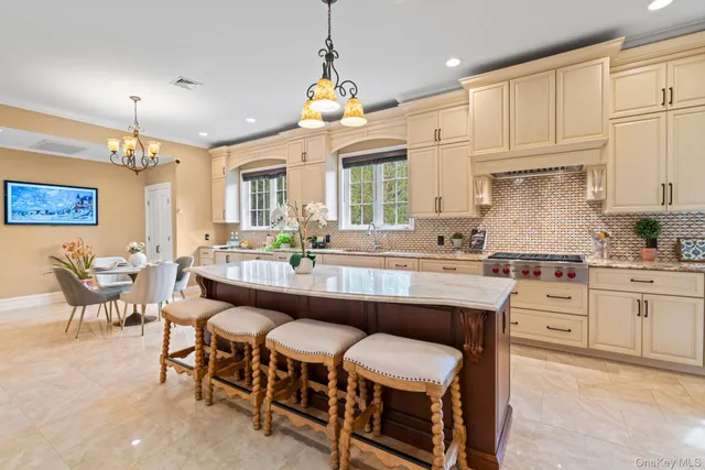 a large kitchen with a table and chairs
