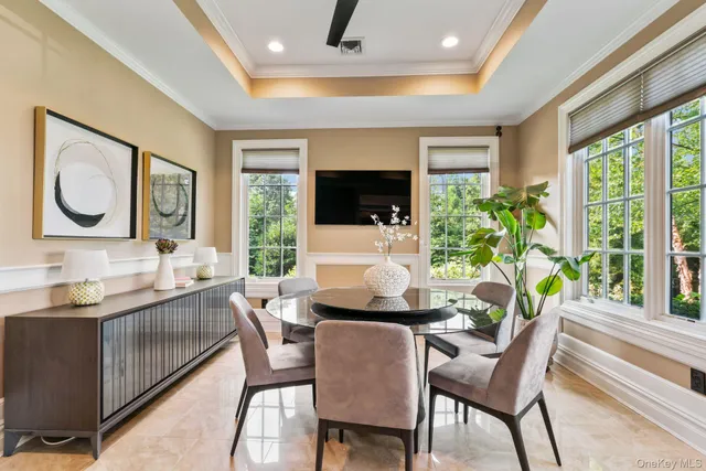 a dining room with furniture and window