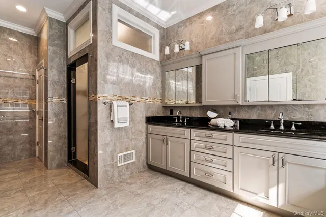 a kitchen with stainless steel appliances granite countertop a refrigerator and a stove