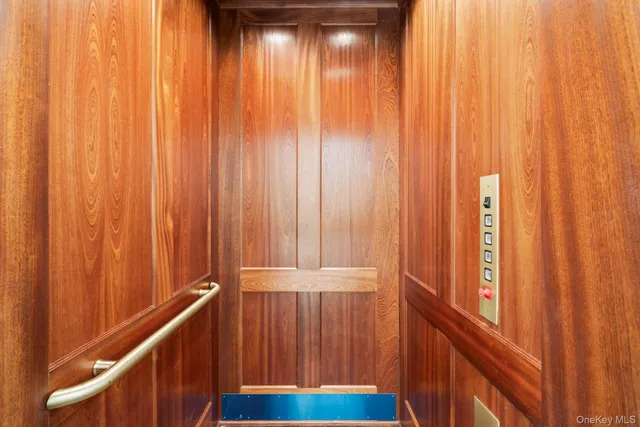 a view of a balcony with wooden walls