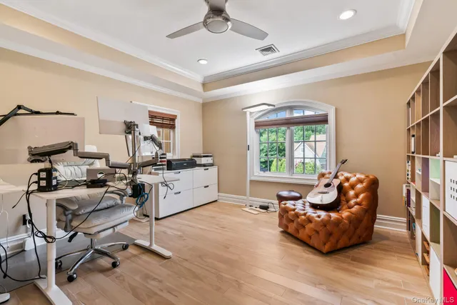 a living room with furniture window and wooden floor