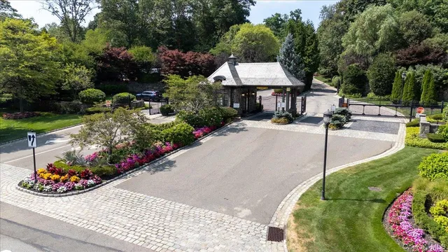 a front view of a house with a garden and pathway