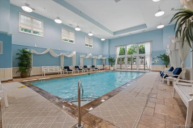a view of a living room and kitchen