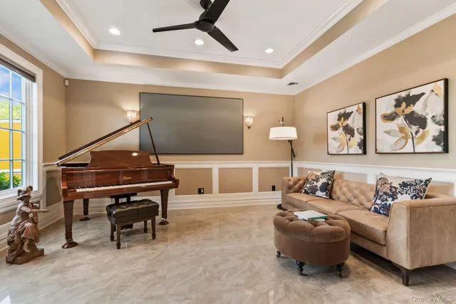 a living room with furniture and a piano