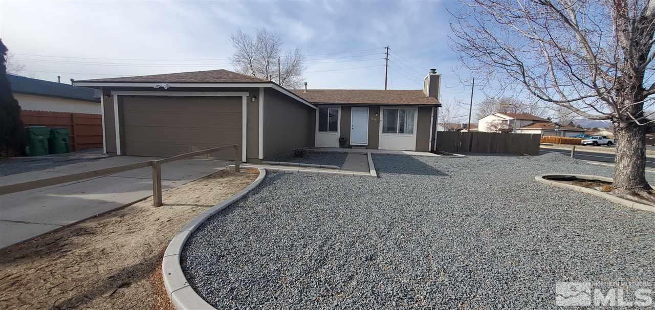14095 Kernite Street Reno, NV 89506 - Photo 1 of 13 a front view of a house with garden