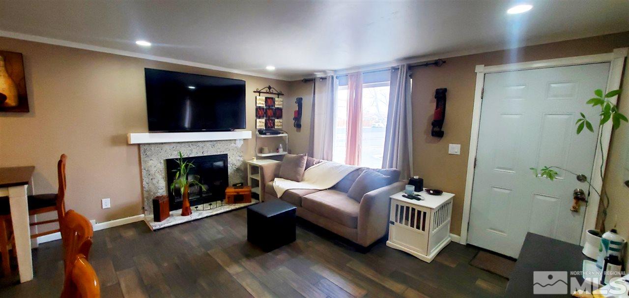 14095 Kernite Street Reno, NV 89506 - Photo 11 of 13 a living room with furniture and a fireplace