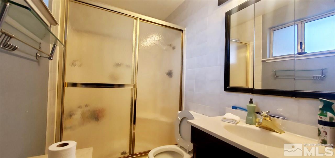 14095 Kernite Street Reno, NV 89506 - Photo 7 of 13 a bathroom with a sink and a mirror