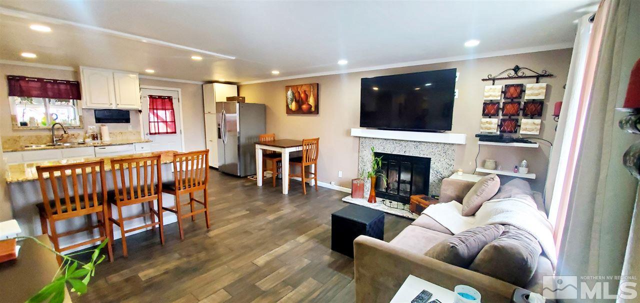 14095 Kernite Street Reno, NV 89506 - Photo 10 of 13 a living room with furniture and a flat screen tv