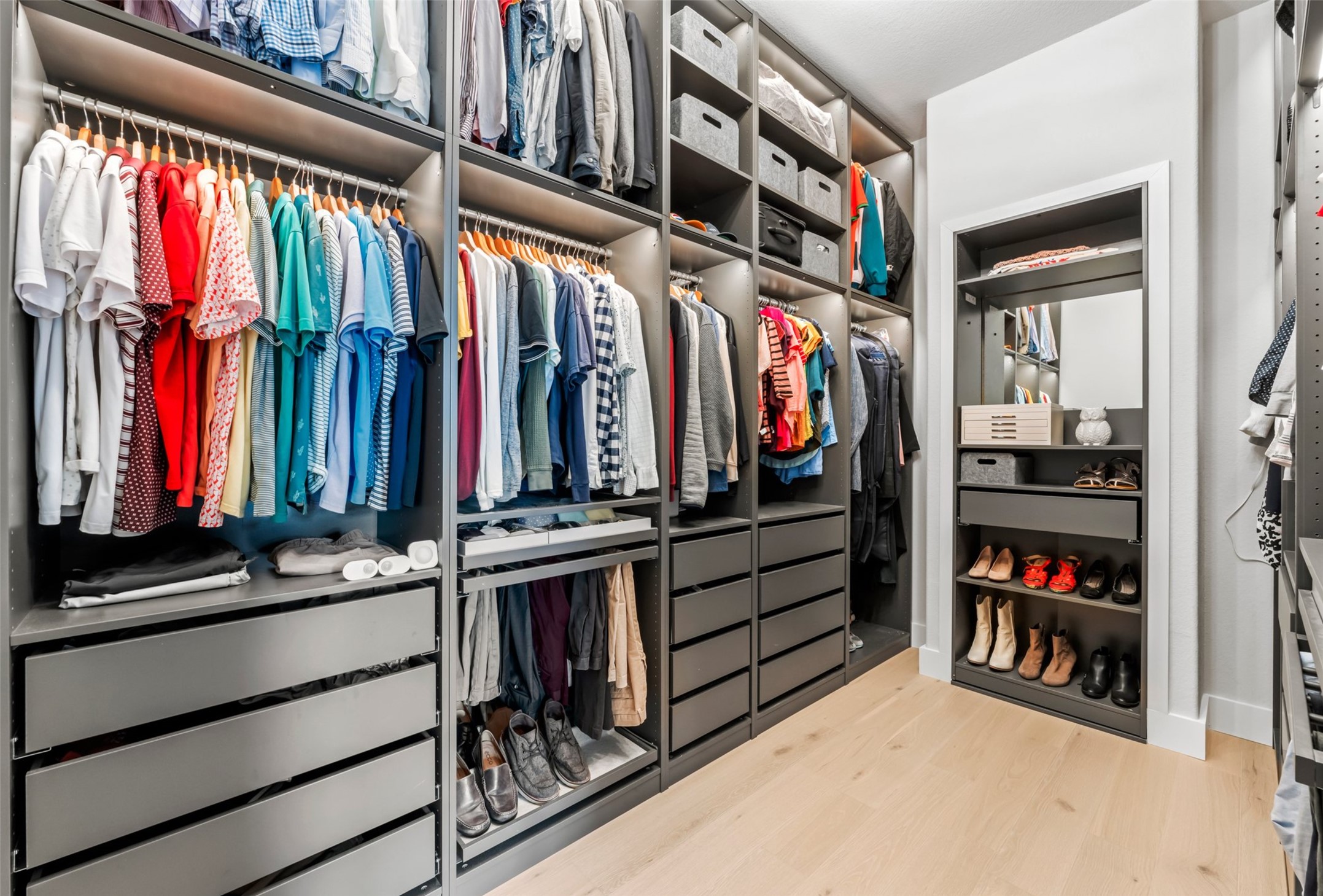 1053 Bat Hawk Court Conroe, TX 77385 - Photo 32 of 50 a view of walk in closet with clothes and shoes