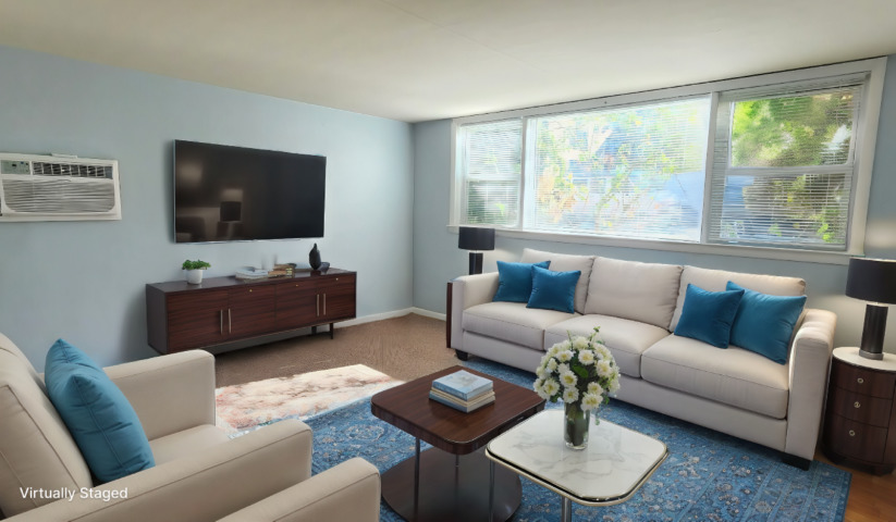 2552 West Rascher Avenue, Unit G Chicago, IL 60625 - Photo 2 of 8 a living room with furniture and a flat screen tv