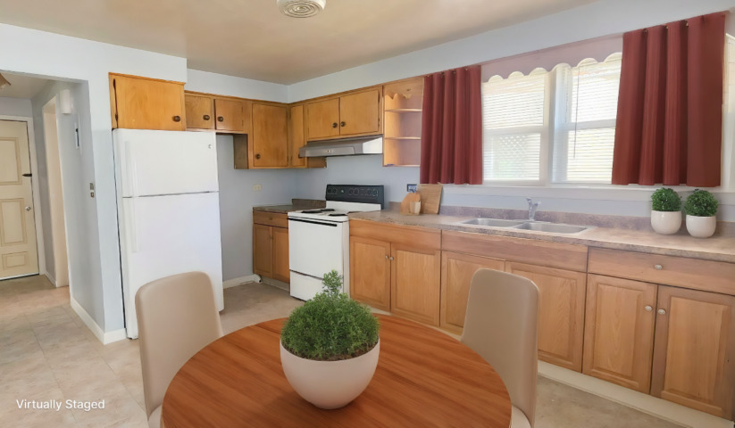 2552 West Rascher Avenue, Unit G Chicago, IL 60625 - Photo 3 of 8 a kitchen with stainless steel appliances granite countertop a stove a sink a refrigerator and white cabinets with wooden floor