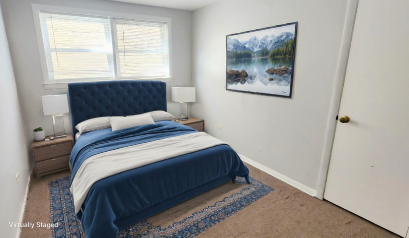 2552 West Rascher Avenue, Unit G Chicago, IL 60625 - Photo 5 of 8 a bedroom with a bed and a window