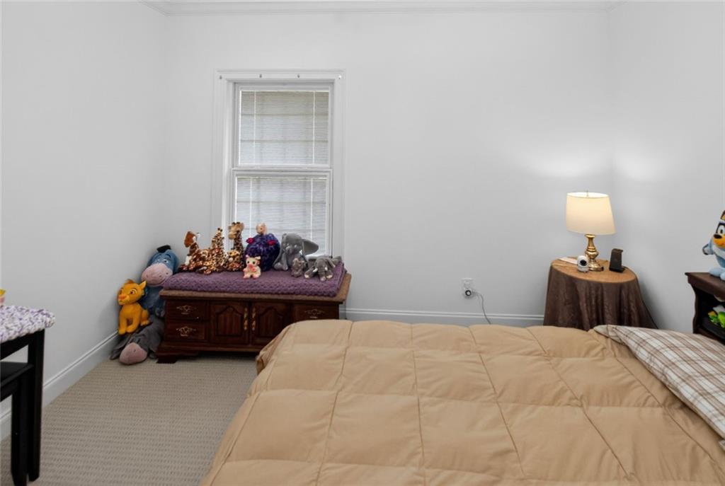 4113 Ledan Extension Gainesville, GA 30506 - Photo 121 of 195 a bedroom with a bed and a lamp on desk