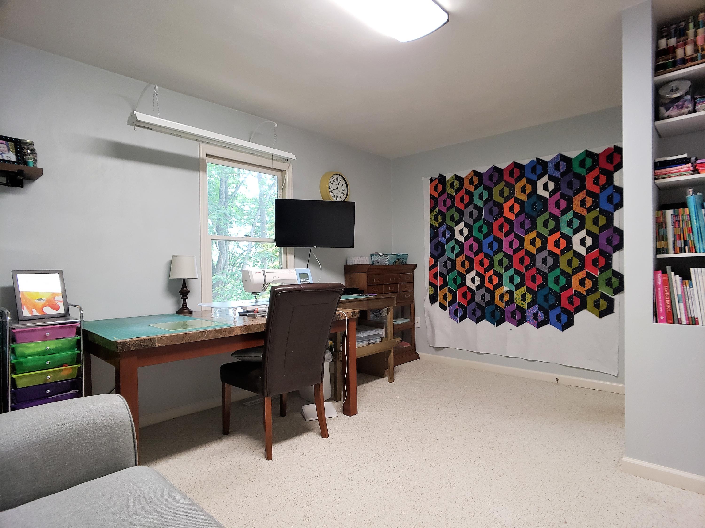 1259 Windy Hill Road Goodview, VA 24095 - Photo 22 of 36 a workspace with furniture and a flat screen tv