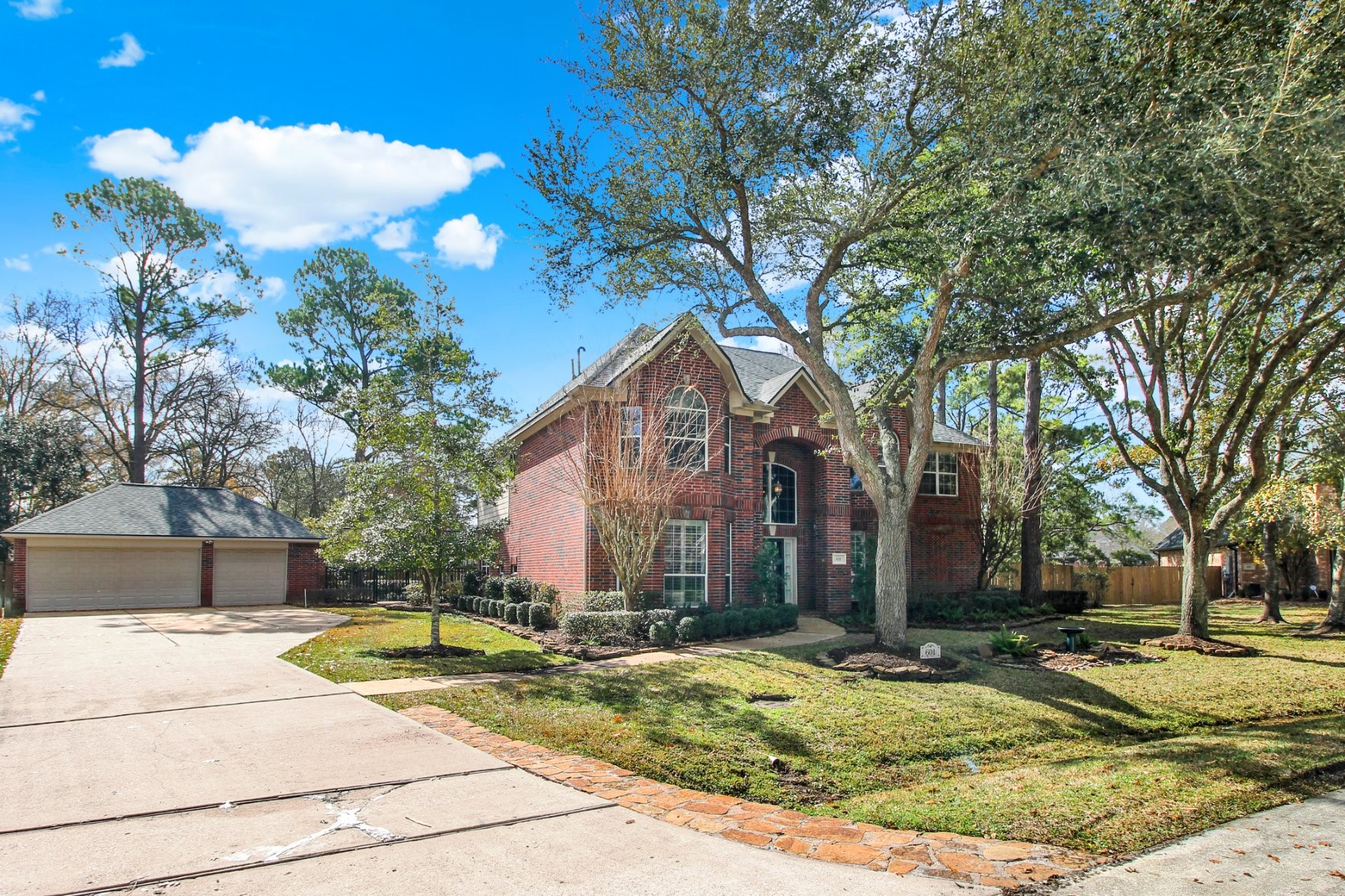 601 Forest Bend Lane Friendswood, TX 77546 - Photo 2 of 27 a view of a house with basketball court