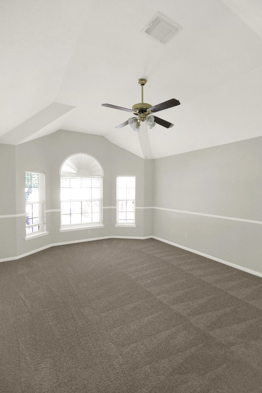 601 Forest Bend Lane Friendswood, TX 77546 - Photo 21 of 27 an empty room with windows and fan