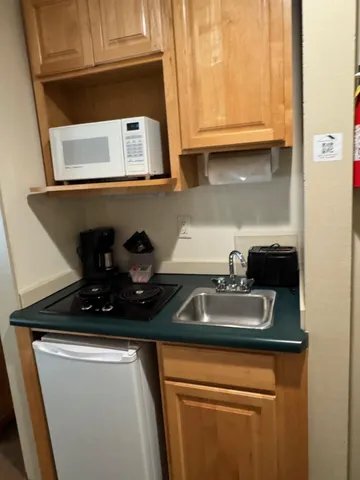 a kitchen with a sink and a stove