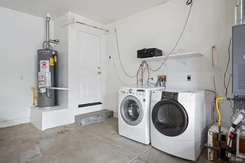 a view of a house with a yard and garage