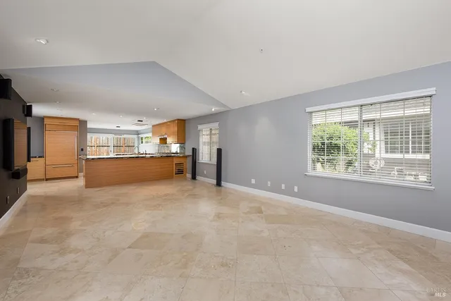 a view of a kitchen with a sink and a window