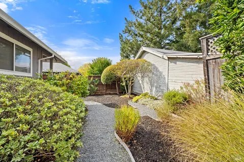 a view of a house with a backyard