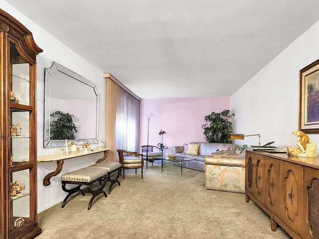 a living room with furniture window and wooden floor