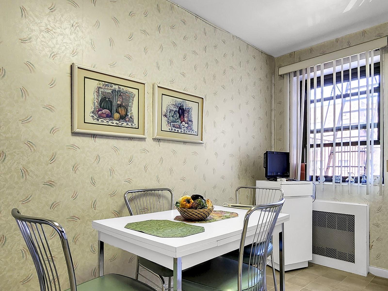 140-21 31st Road, Unit 4A Queens, NY 11354 - Photo 4 of 7 a view of a dining room with furniture and window