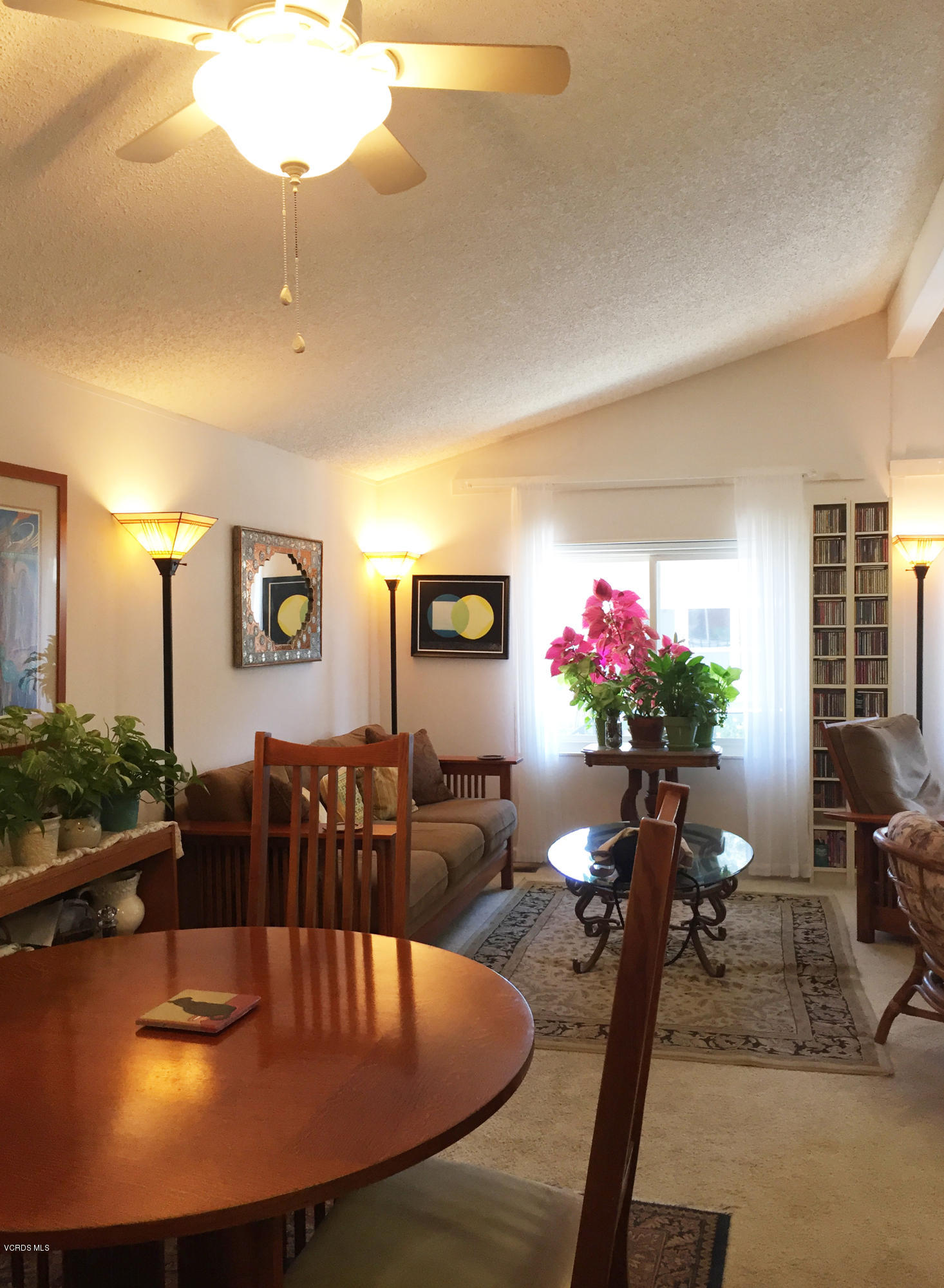 1225 South Rice Road, Unit 25 Ojai, CA 93023 - Photo 35 of 35 a view of a dining room with furniture and a chandelier