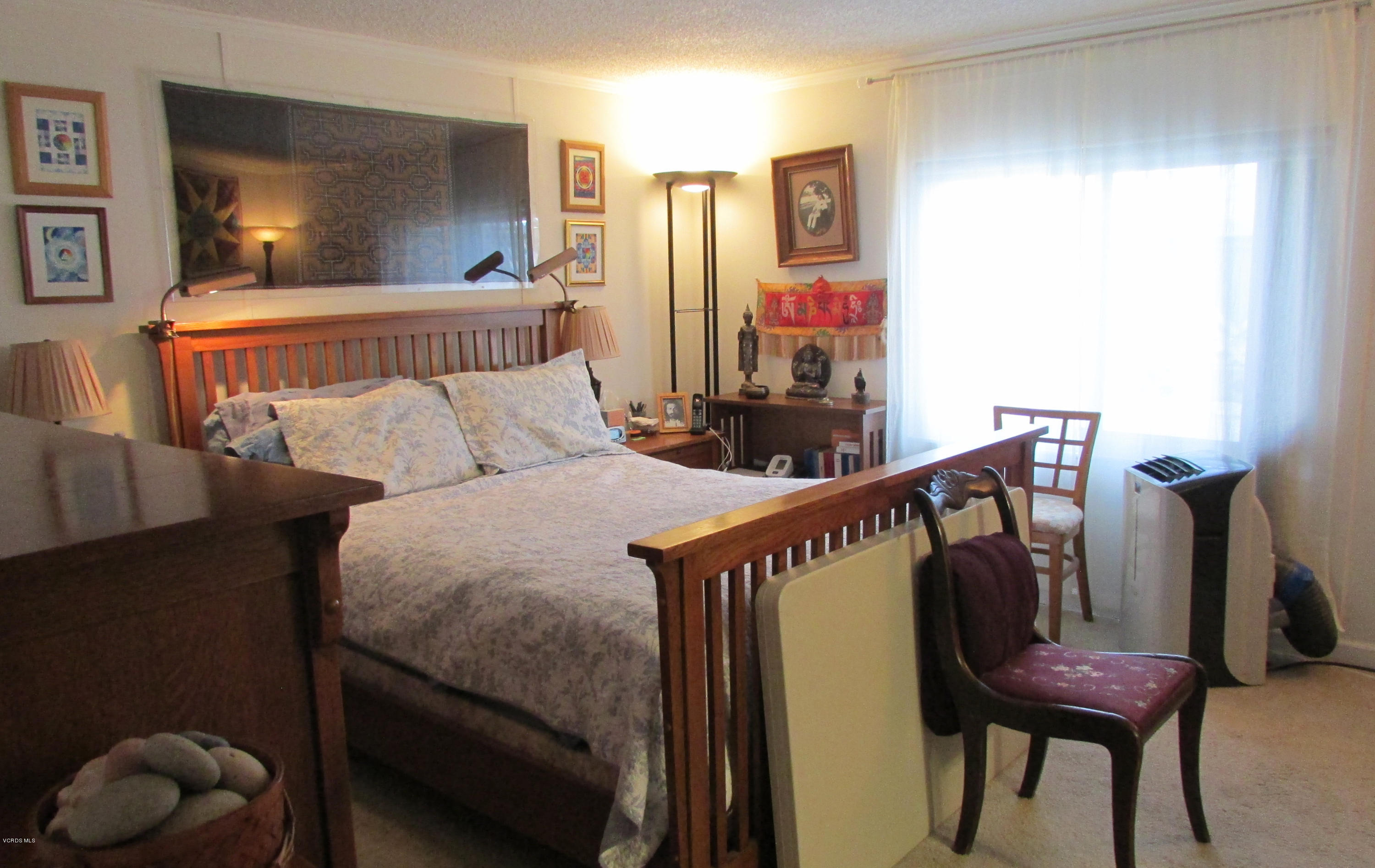1225 South Rice Road, Unit 25 Ojai, CA 93023 - Photo 21 of 35 a bed room with furniture and a window