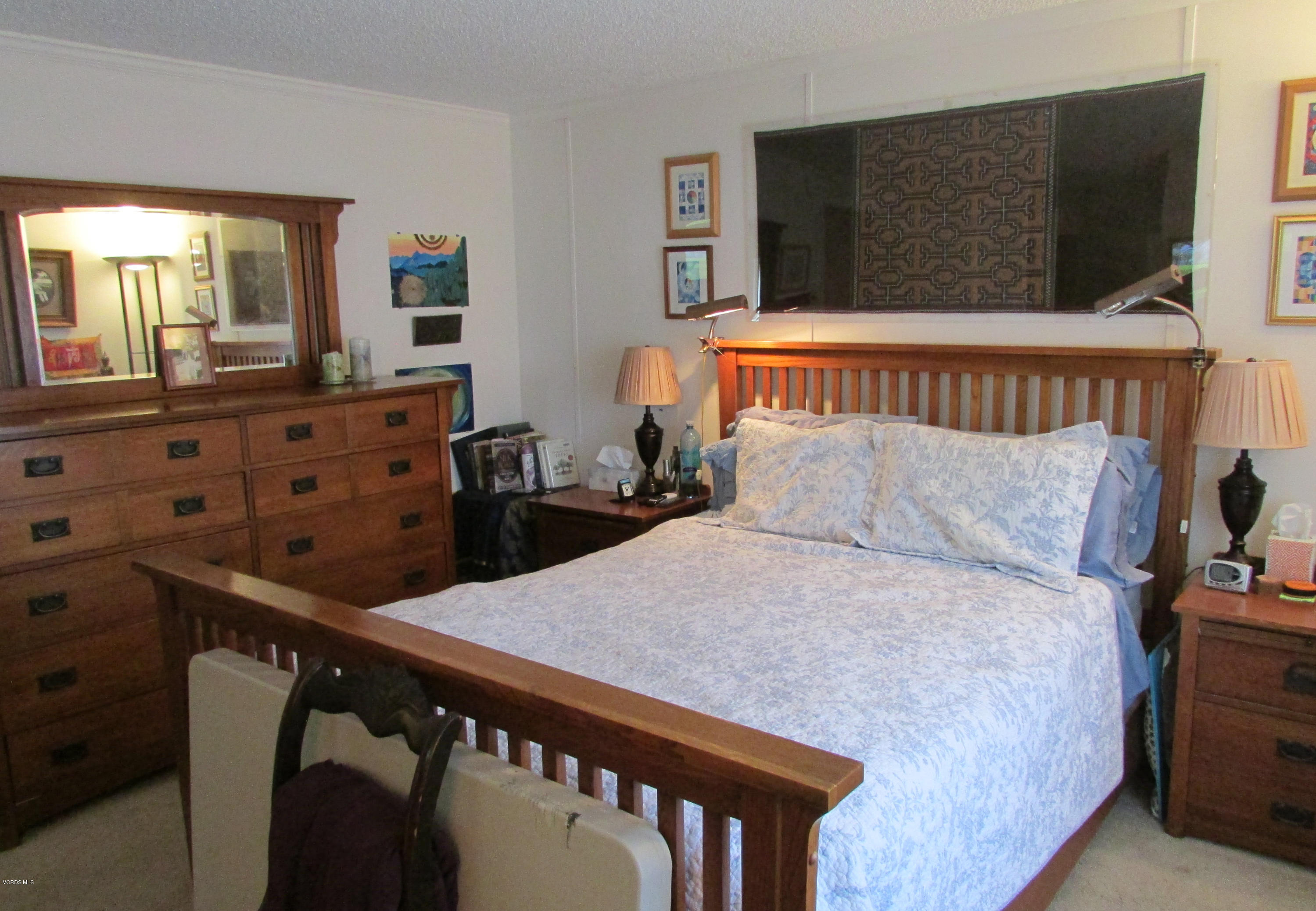 1225 South Rice Road, Unit 25 Ojai, CA 93023 - Photo 22 of 35 a bed room with a bed and a television