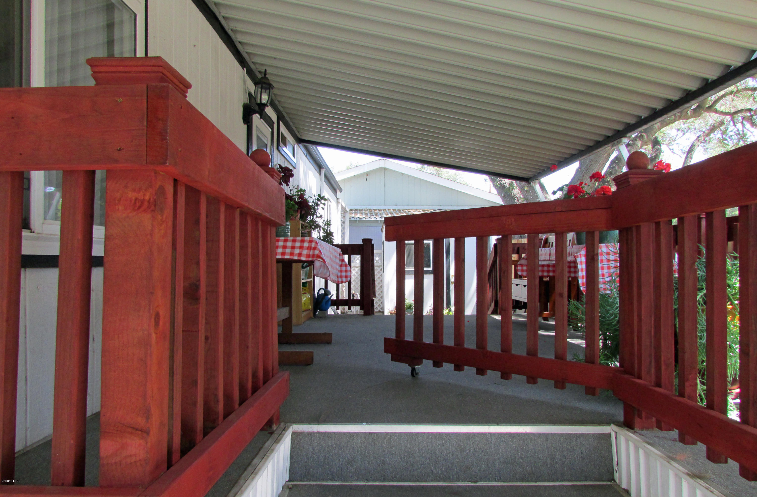 1225 South Rice Road, Unit 25 Ojai, CA 93023 - Photo 9 of 35 a view of a porch with wooden floor