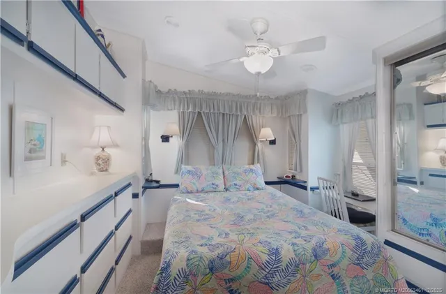 a spacious bathroom with a sink and a mirror