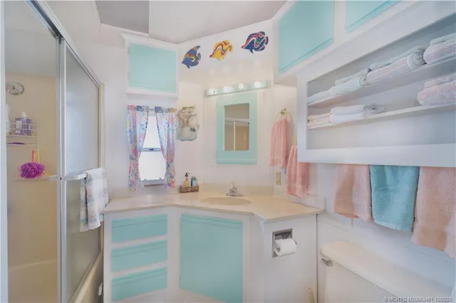 a bathroom with a sink vanity and a mirror