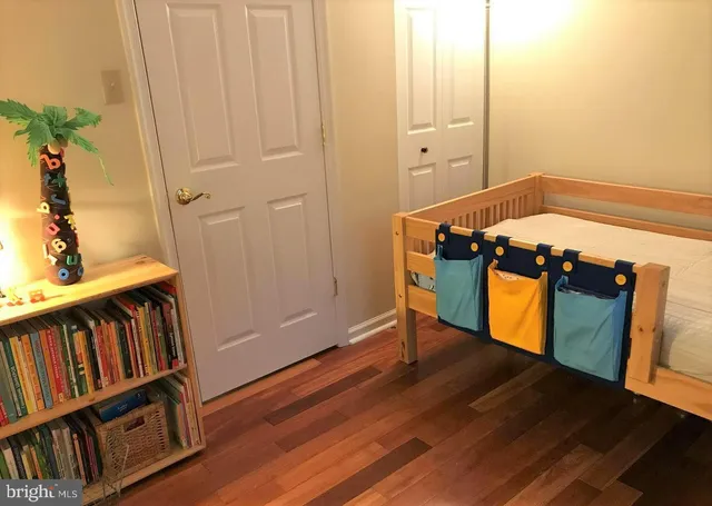 a view of front door and wooden floor