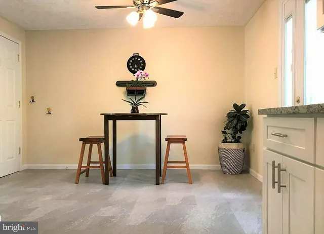 a view of a workspace with furniture