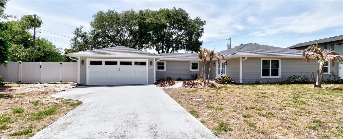 7989 143rd Street Sebastian, FL 32958 - Photo 29 of 30 a front view of a house with a yard