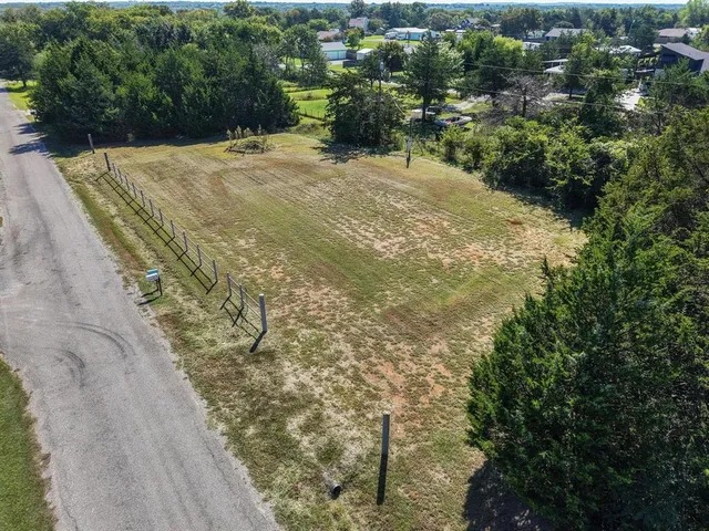 a view of a yard with trees