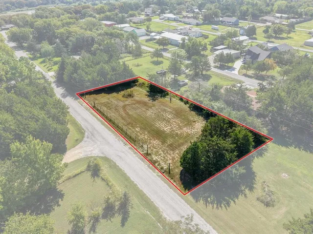 a view of a back yard from a balcony