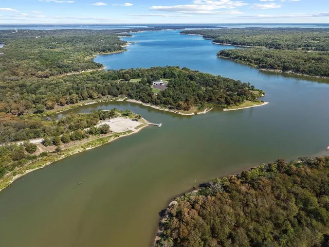 an aerial view of residential building with an outdoor space and seating