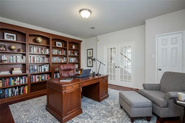 a large kitchen with stainless steel appliances granite countertop a stove a sink and a microwave