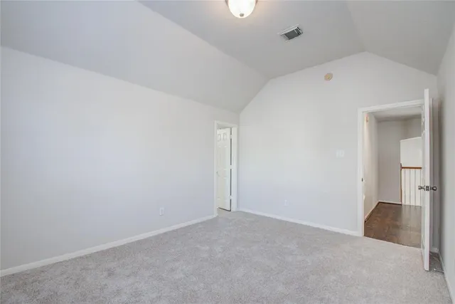 a bathroom with a granite countertop sink a mirror and bathtub