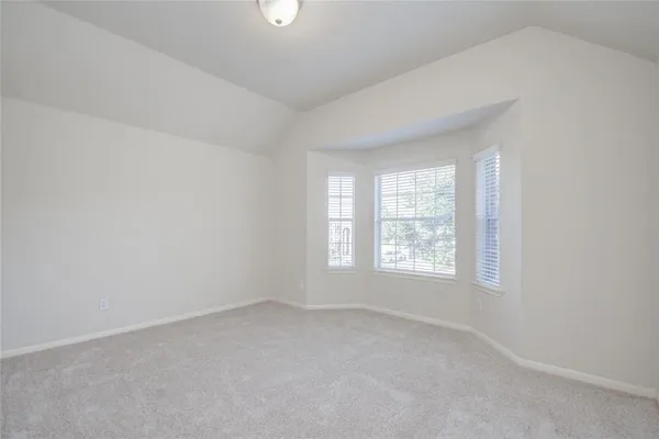 a view of a brick house with an outdoor space