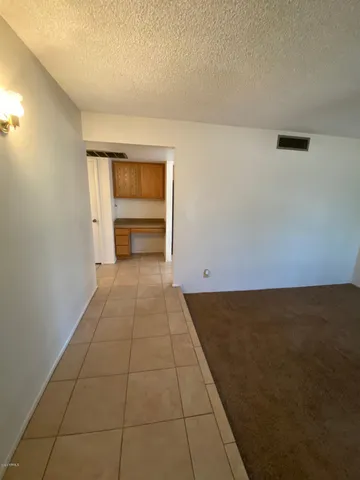 an empty room with cabinet