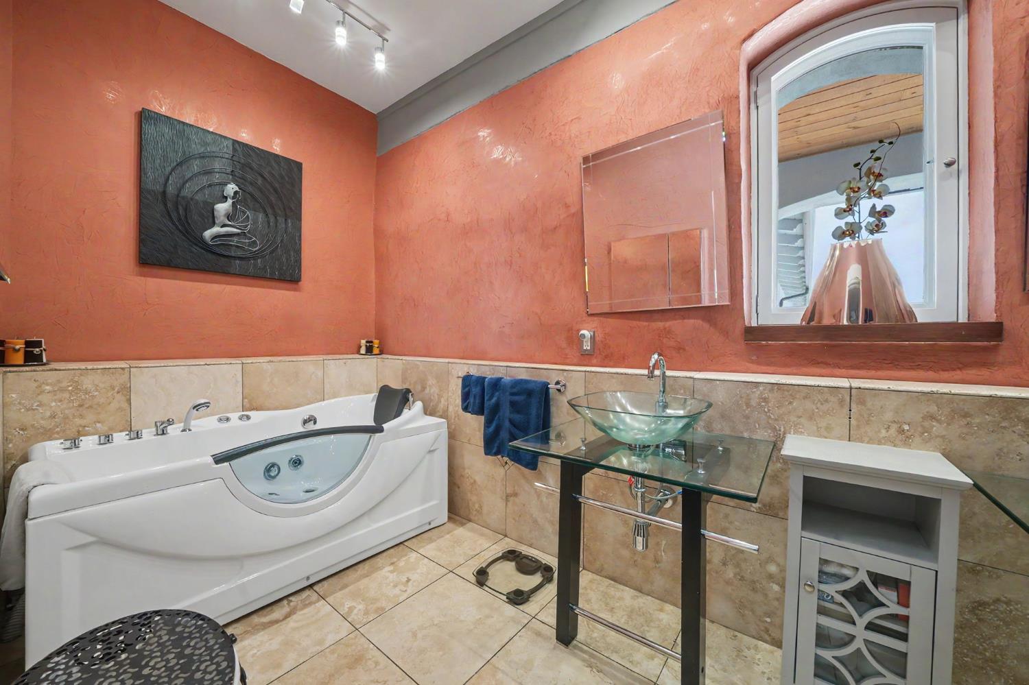 15070 Willow Creek Road Ione, CA 95640 - Photo 49 of 66 a bathroom with a bathtub and a sink