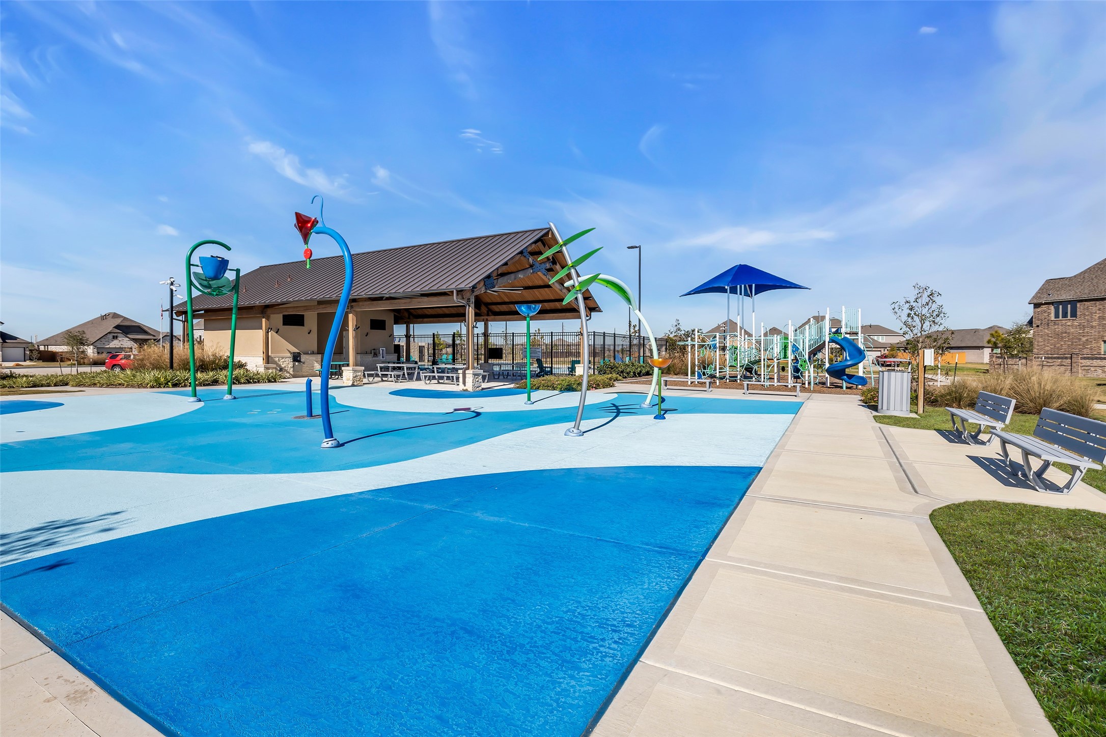 8619 Jade Hl Drive Rosharon, TX 77583 - Photo 49 of 50 Neighborhood recreation area with splash pad, playground, and pavilion seating, providing a built-in extension of the community lifestyle.