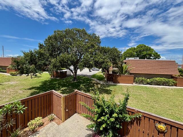 3900 County Line Road, Unit 26C Tequesta, FL 33469 - Photo 4 of 12 a view of a deck with a garden