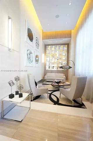 a view of a lobby with black carpet