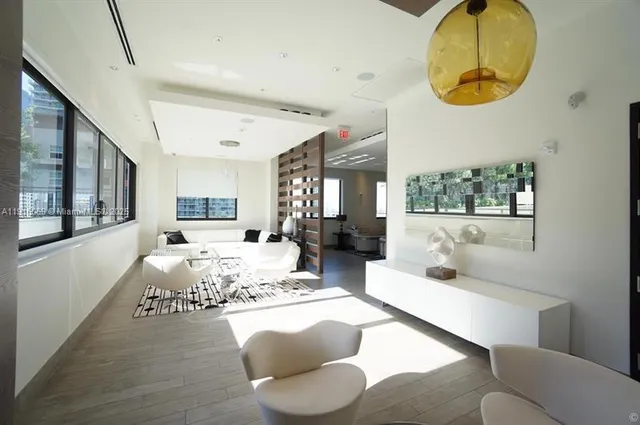 a swimming pool with outdoor seating and yard